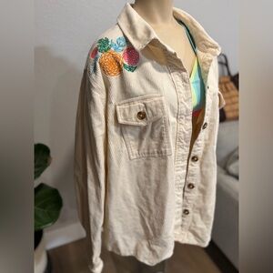 Disney Pixar Coco themed cream corduroy shirt jacket featuring